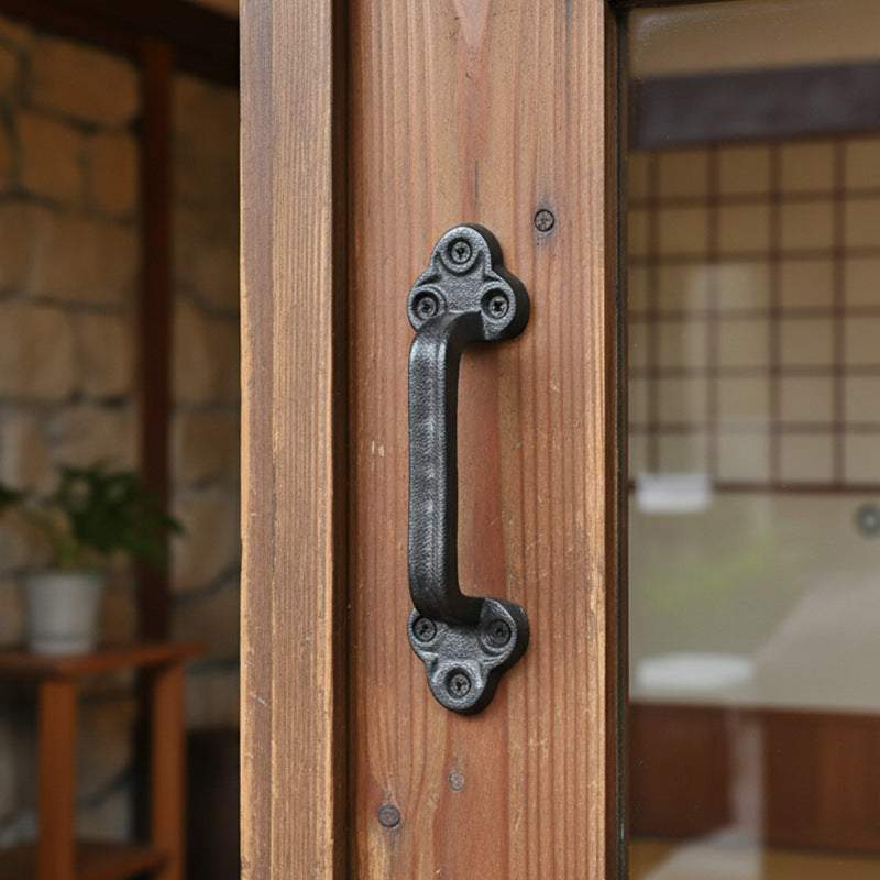 Rustic Black Cast Iron Door Pull Handle on a warm wood door
