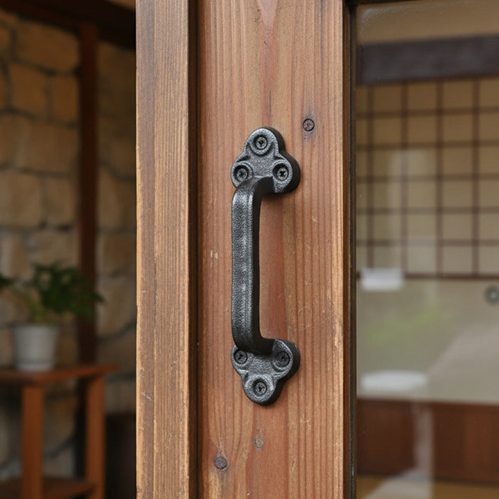 Rustic Black Cast Iron Door Pull Handle on a warm wood door