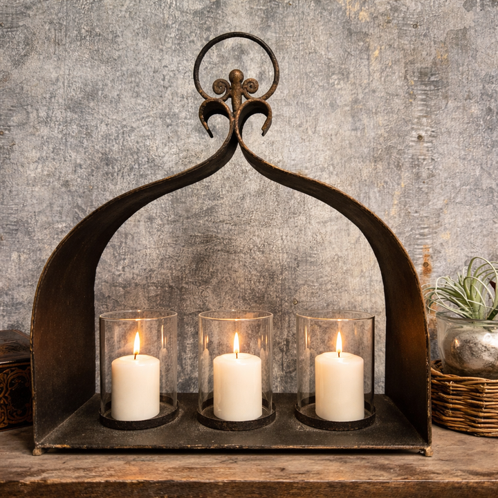 Side view of the stepped iron candle holder and glass cups
