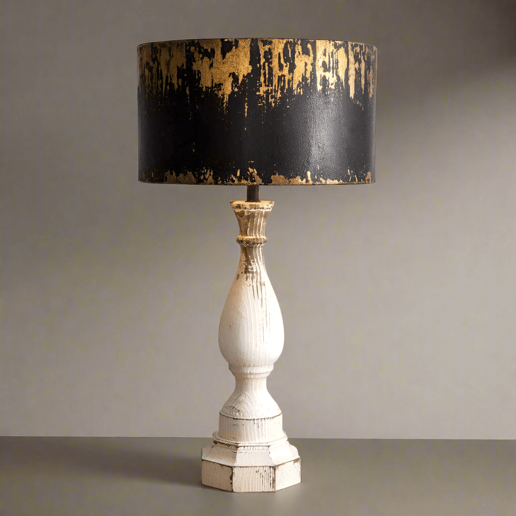 Rustic table lamp featuring a distressed metal shade and white wooden base, adding vintage charm to home decor.