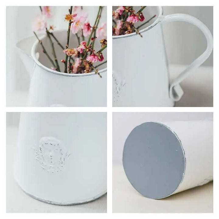 Rustic white metal flower pitcher vases in a garden setting