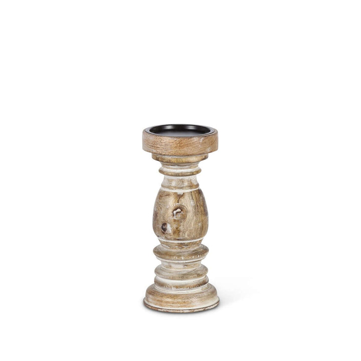 Rustic whitewashed mango wood pillar candle holder with intricate hand-carved design showcasing natural grain and knots.