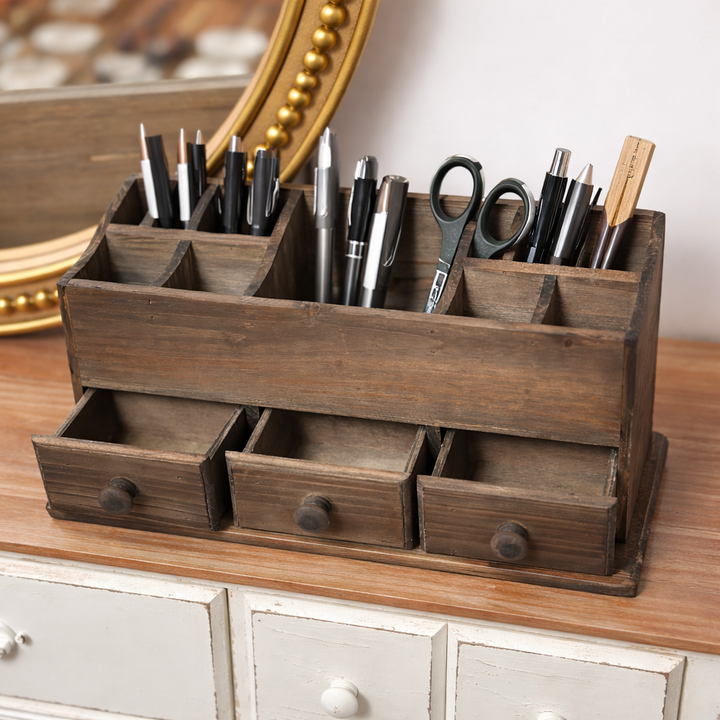 Angled view with drawers open and upper compartments filled with pens