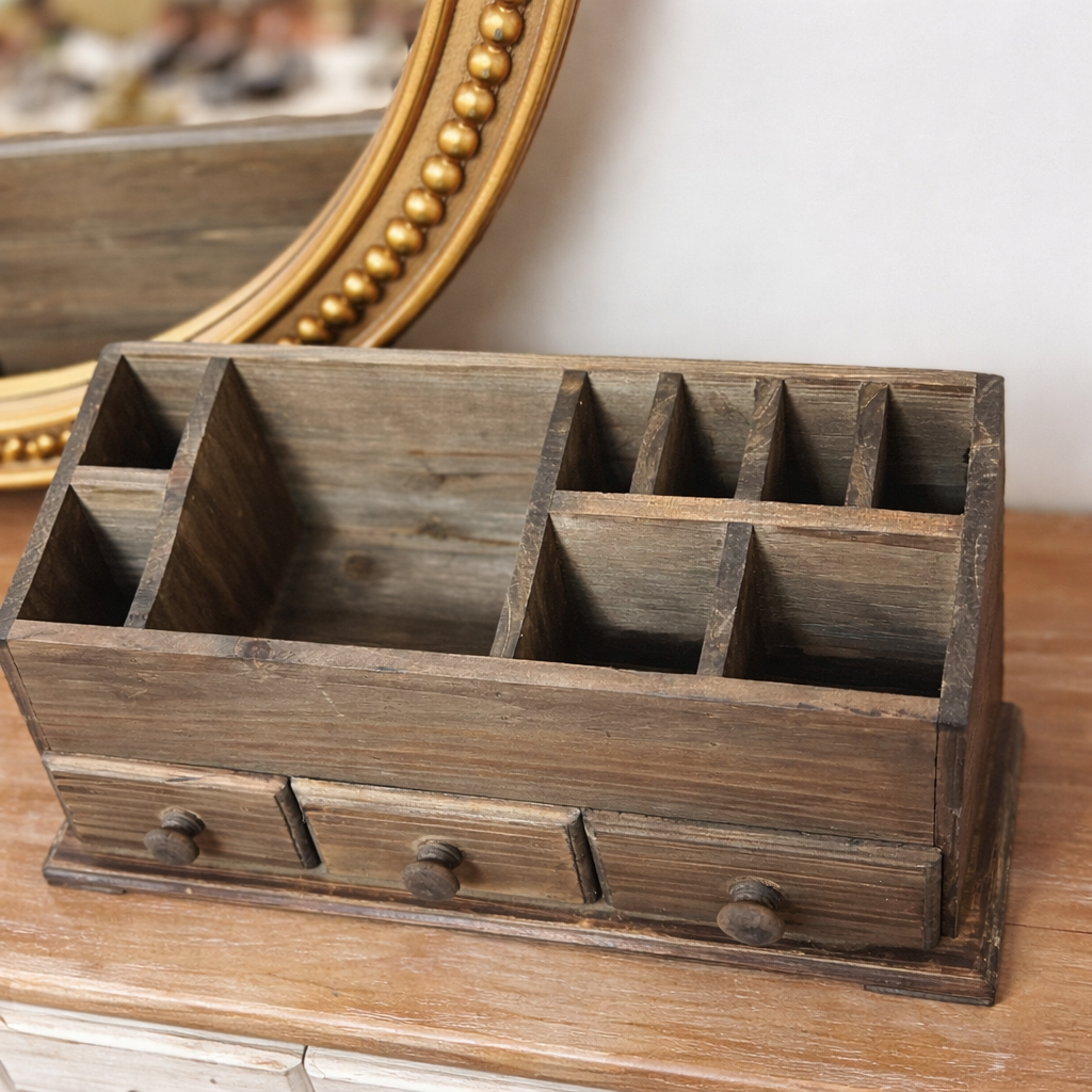 Empty desktop organizer showing the divided top and three lower drawers