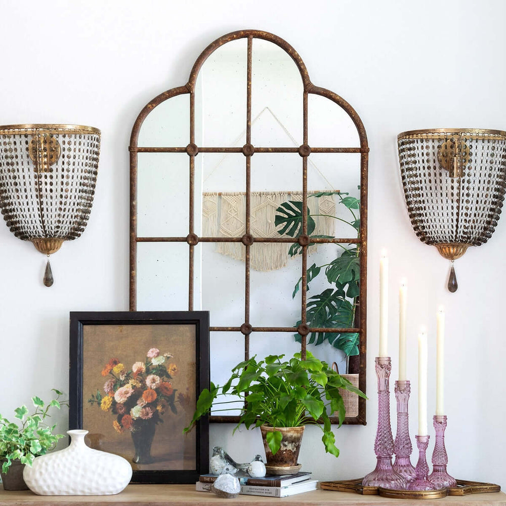 Rustic Farmhouse Iron Windowpane Mirror with decorative candles and plants on a mantel for vintage country home decor.