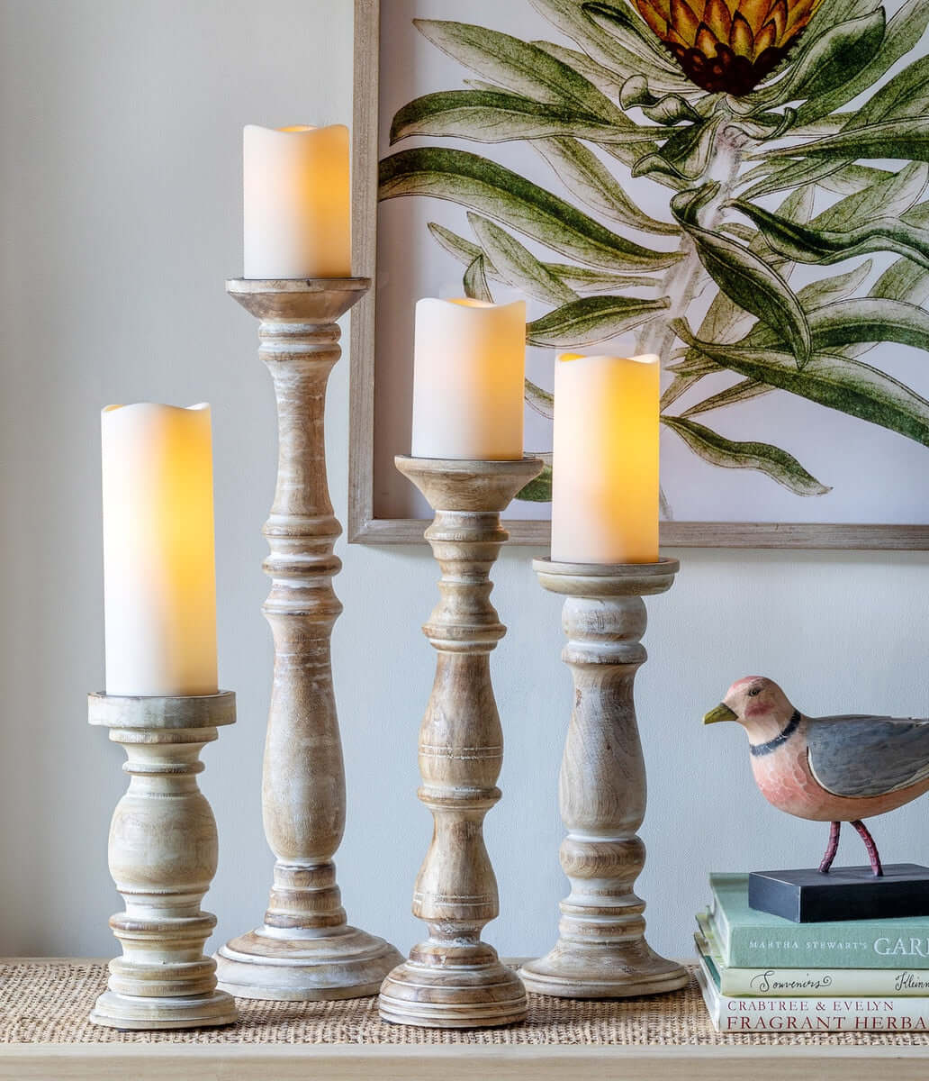Rustic Farmhouse Whitewashed Wood Candle Holders Set of 2, made of solid mango wood with a hand-distressed finish, on a wooden table.
