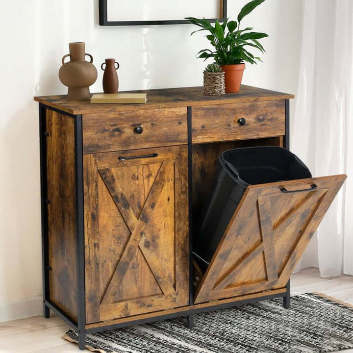 Rustic Farmhouse Tilt Out Trash Cabinet with dual compartments, warm weathered wood finish, and black metal accents