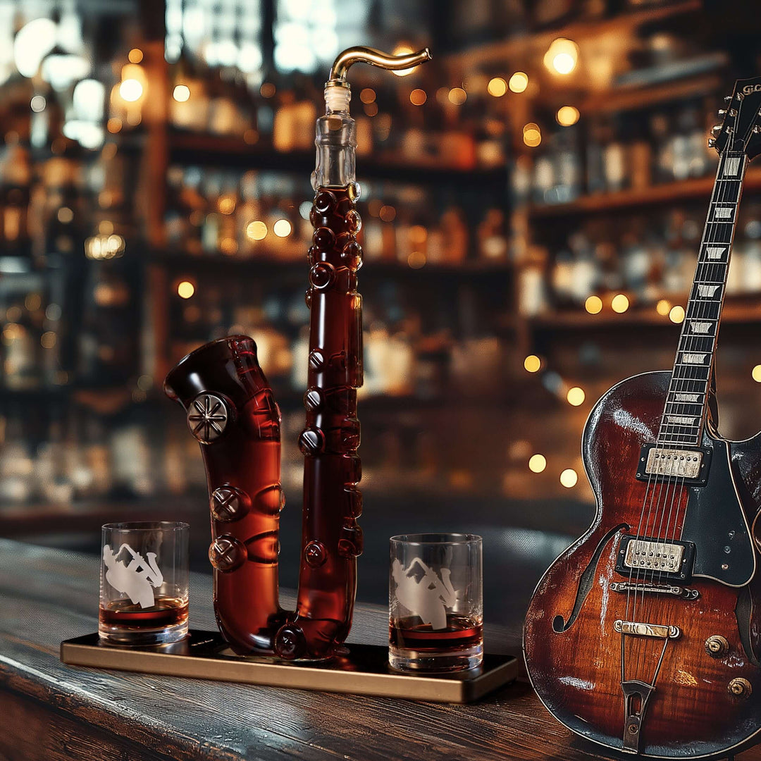 Saxophone Whiskey Decanter Set with Glasses on a wooden bar counter, surrounded by an elegant guitar and warm lighting.