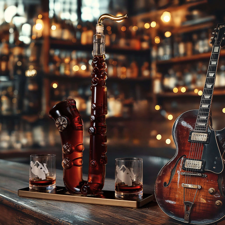 Saxophone Whiskey Decanter Set with Glasses on a wooden bar counter, surrounded by an elegant guitar and warm lighting.