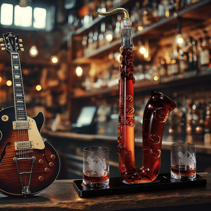 Saxophone Whiskey Decanter Set with Glasses displayed elegantly on a bar counter with a guitar in the background.