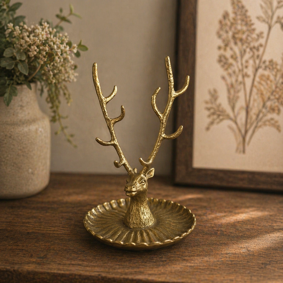 Gold sculpted buck jewelry stand with branching antlers and fluted tray