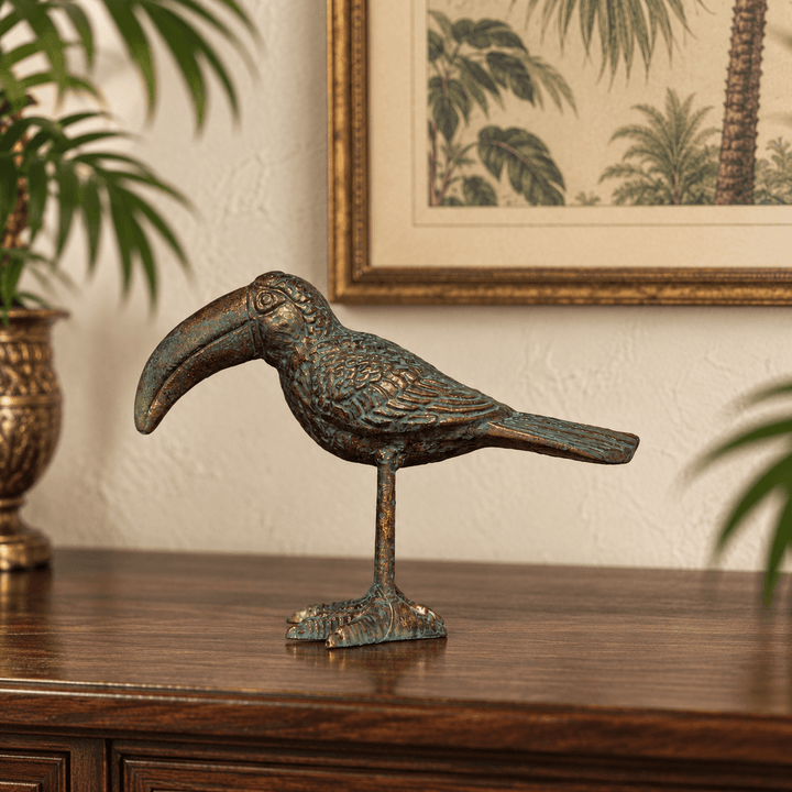 Aged gold Sculpted Iron Toucan Figurine on a wood console