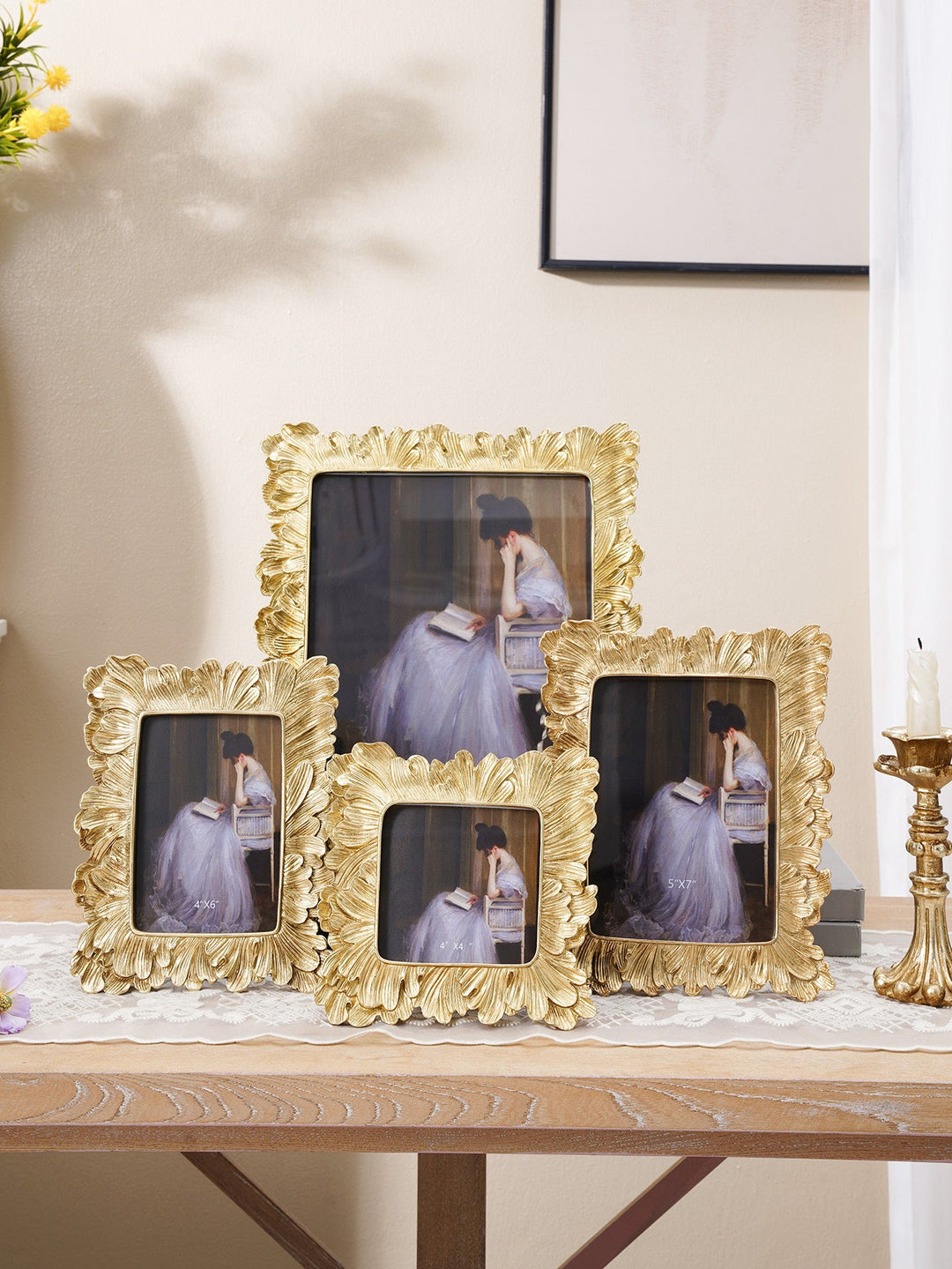 Collection of gold sculpted leaf photo frames in multiple sizes
