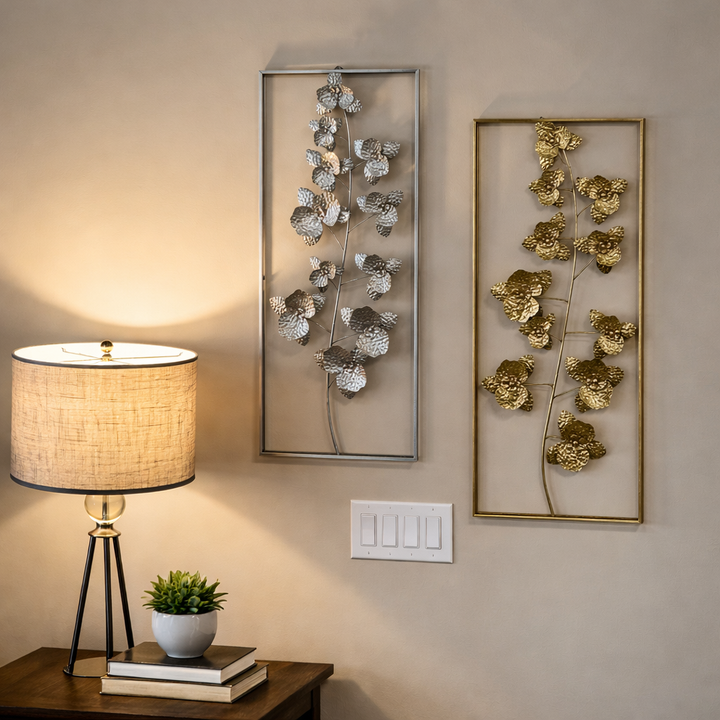 Gold metal flower wall art displayed beside a console