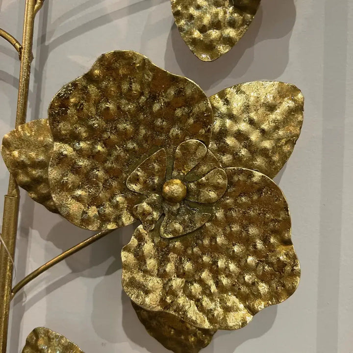 Textured flower centers on the sculpted metal wall panel