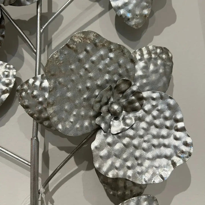 Silver floral wall art with dimensional petals and leaves