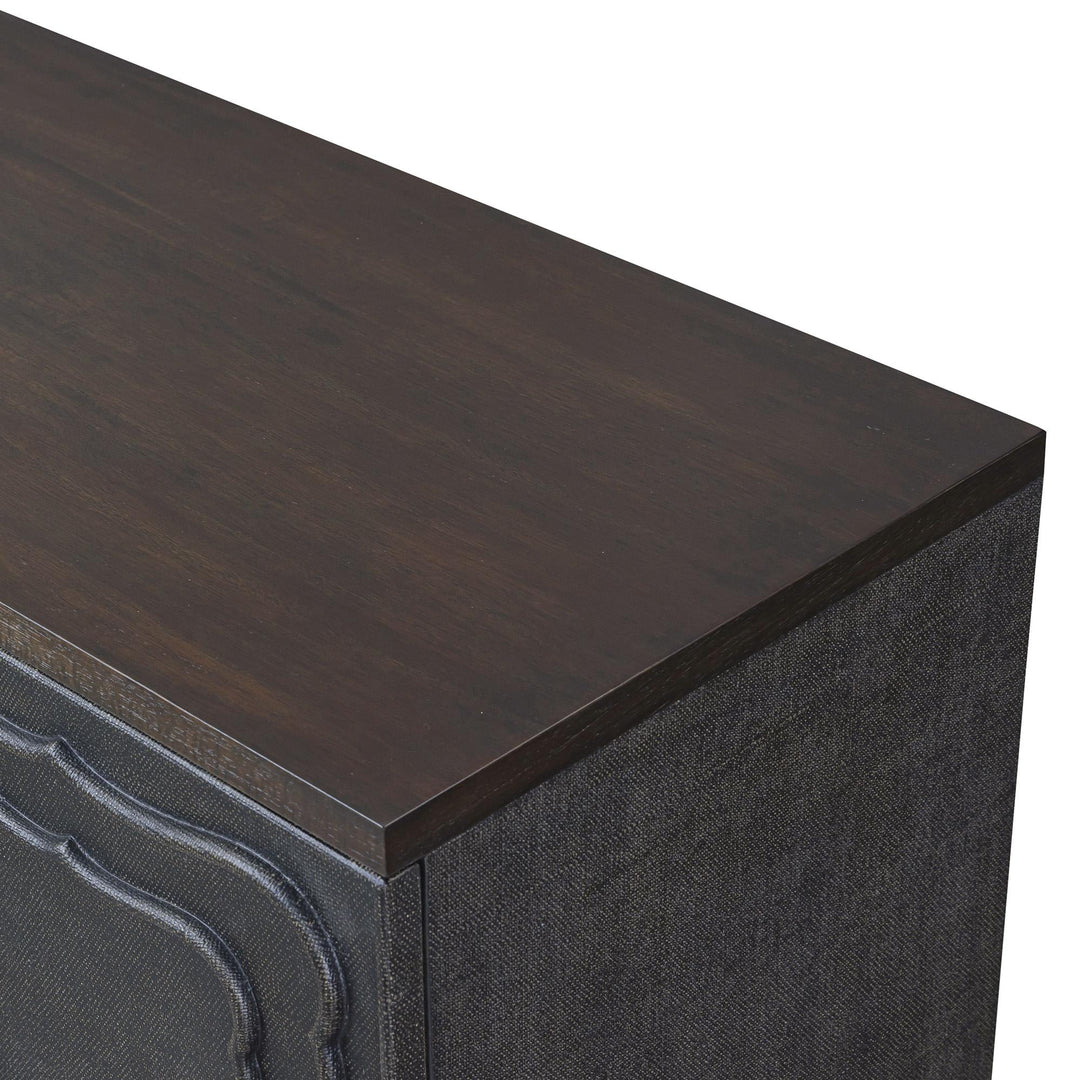 Close-up of the dark wood-toned top above the textured brown side panel.