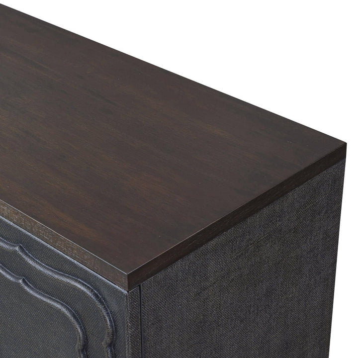 Close-up of the dark wood-toned top above the textured brown side panel.