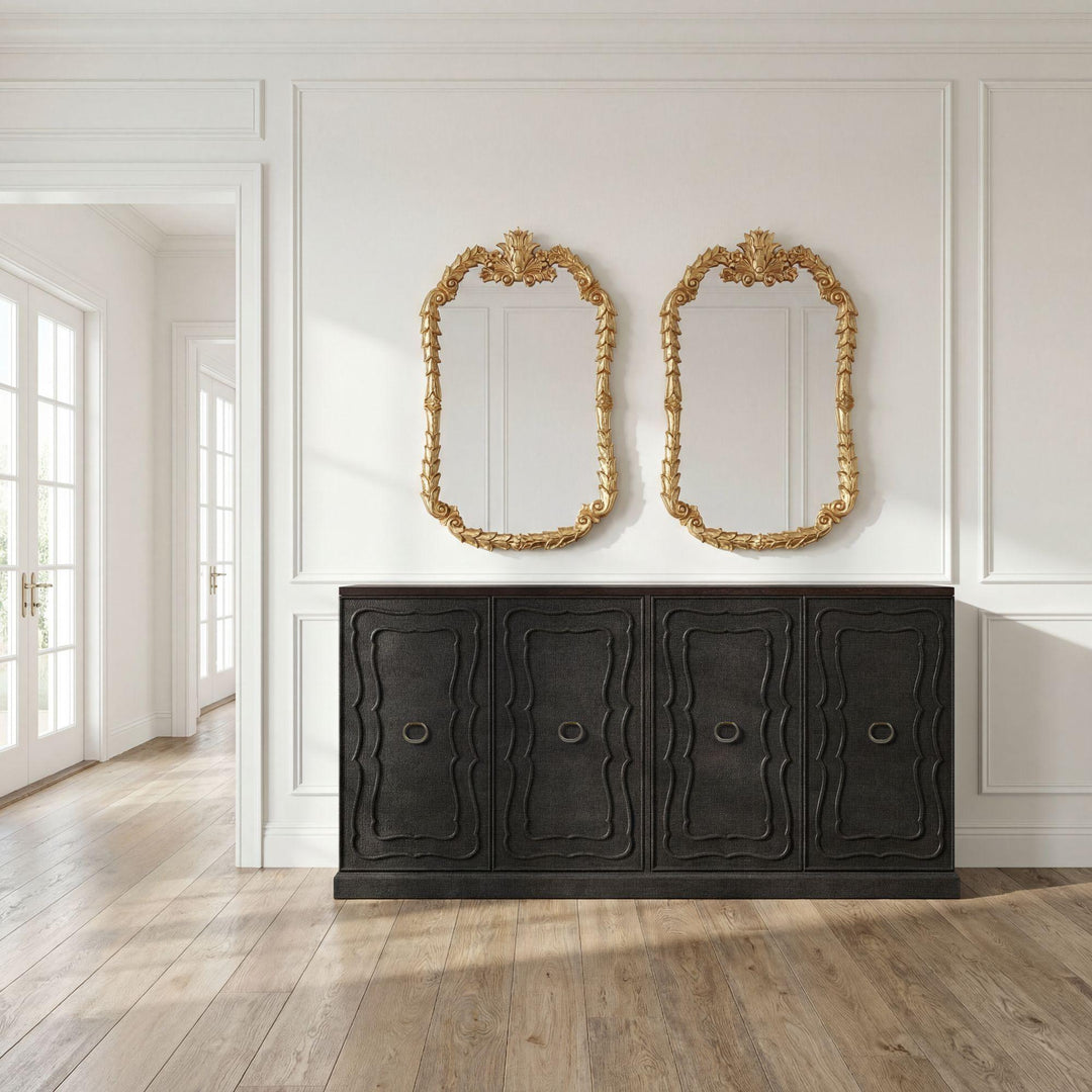 Seal brown sideboard styled below a pair of gilt mirrors; accessories not included.
