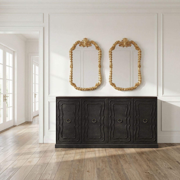 Seal brown sideboard styled below a pair of gilt mirrors; accessories not included.