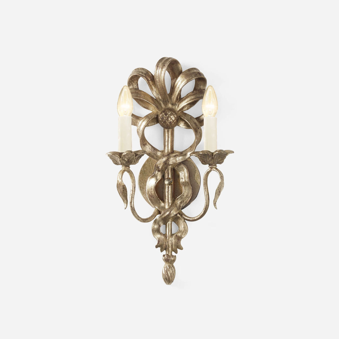 Decorative wall sconce with floral design on a white background