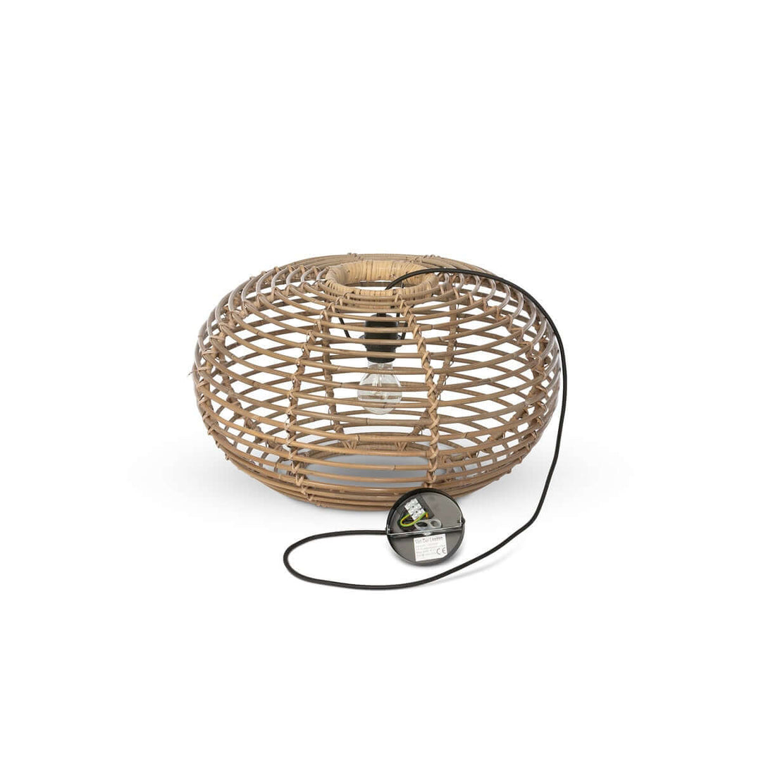 Woven rattan lamp with black cord on a white background