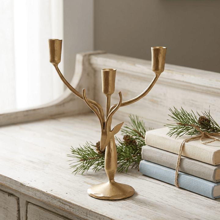 Stag Antler Candelabra in Antiqued Gold Iron, small size on a whitewashed sideboard with pine sprigs