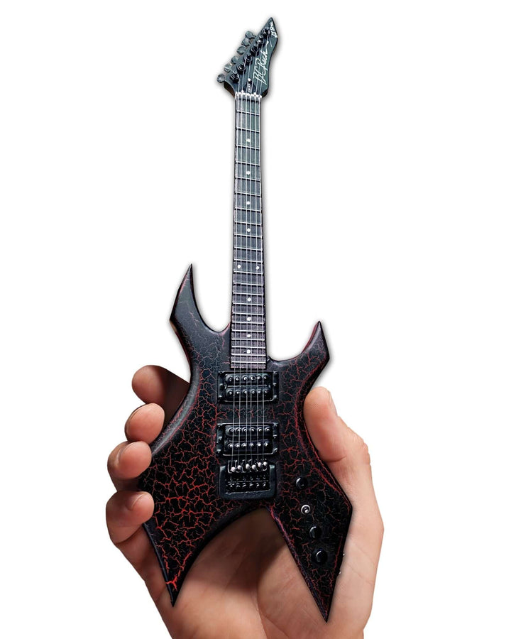 Stranger Things Eddie’s B.C. Rich Warlock Mini Guitar Replica being held, showcasing intricate detailing and design for collectors and fans.
