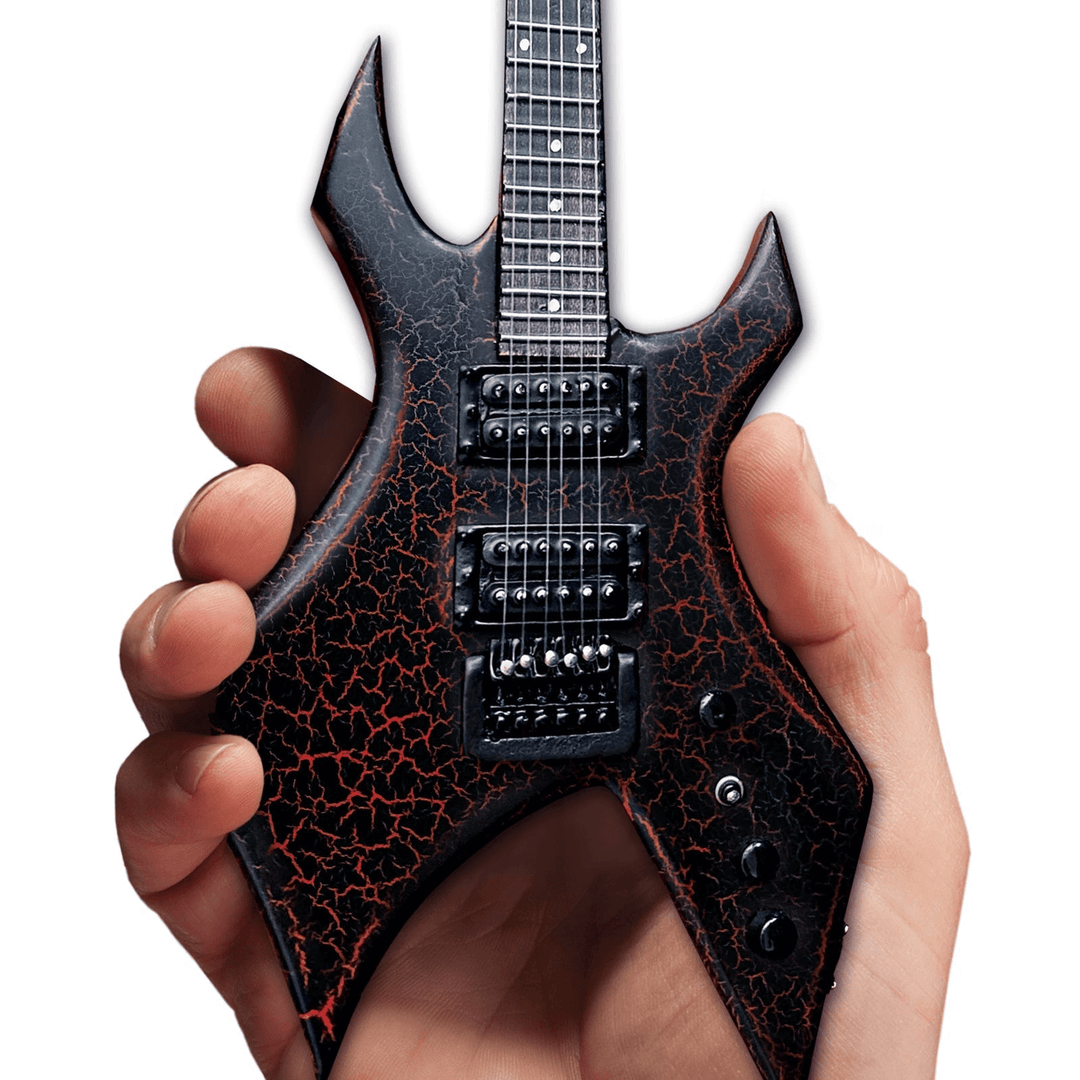 Hand holding Stranger Things Eddie’s B.C. Rich Warlock Mini Guitar Replica, detailed 1:4 scale collectible from TV series.