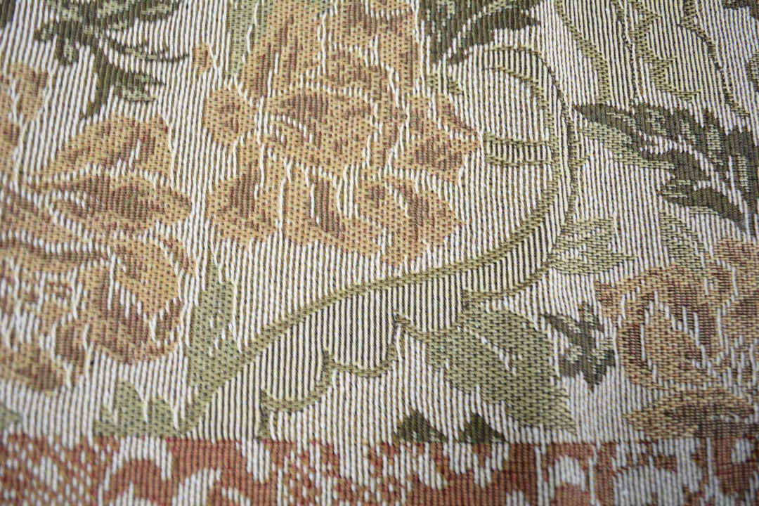 Close-up of DaDa Bedding Floral Nature Garden Beige Orange Spices Tapestry Table Runner (10072) with floral and golden tassel accents.