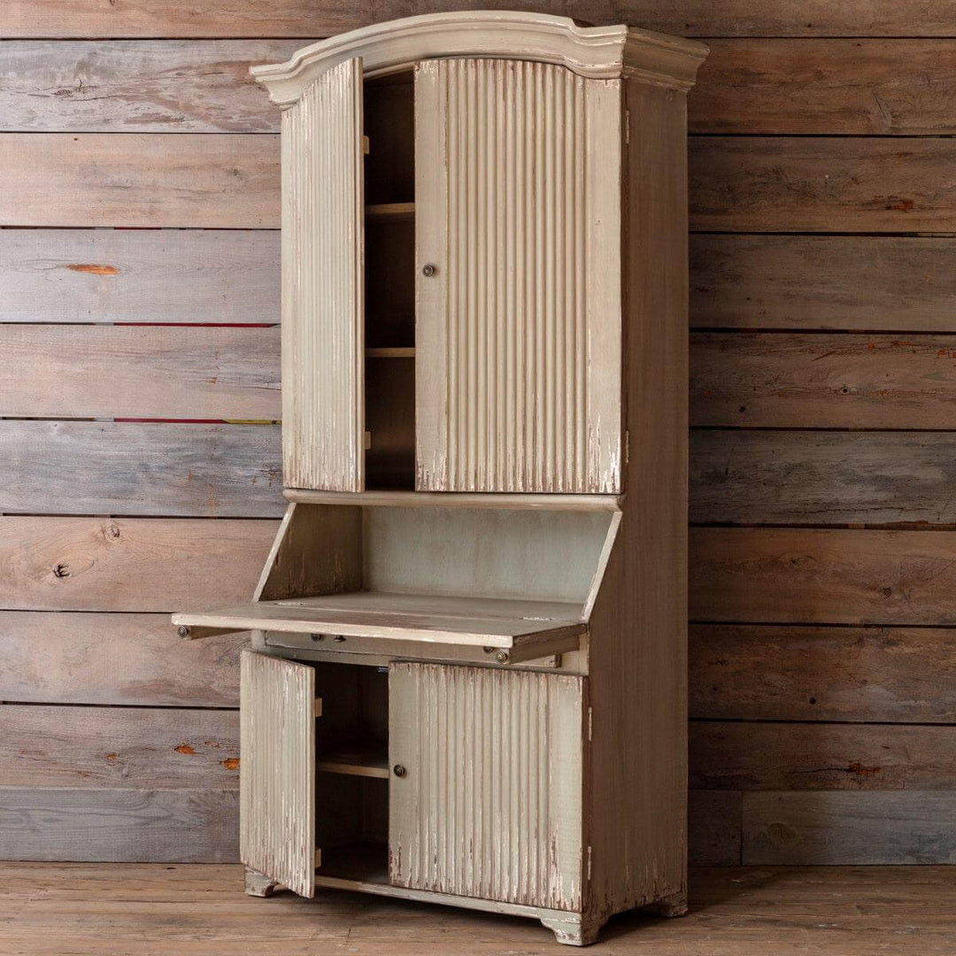 Tall Reclaimed Wood Secretary Cabinet with rustic European design against wooden background