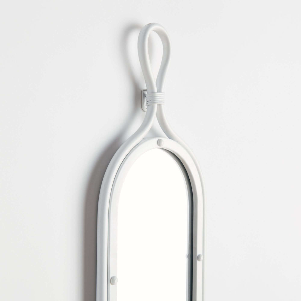 Tall white vintage French mirror with curved top and looped hanger detail, stylish home decor accent.