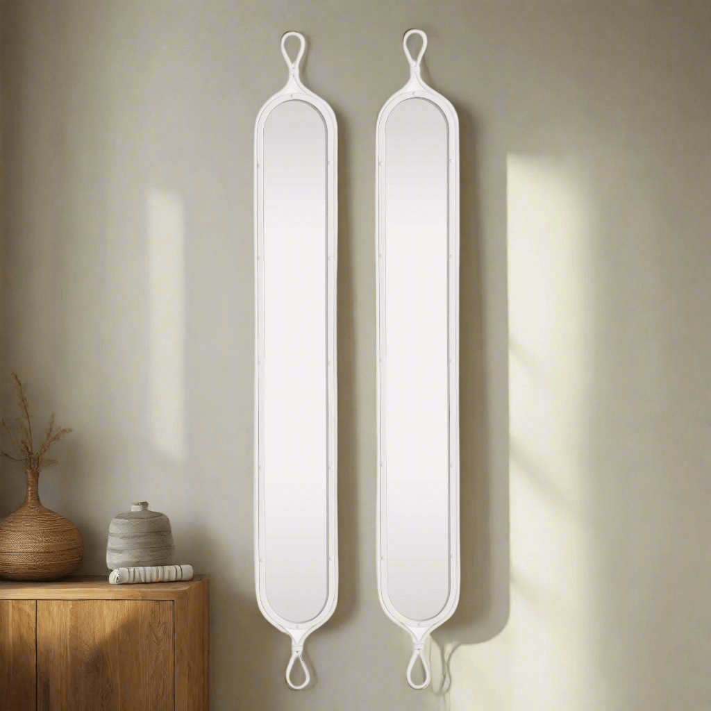 Tall white mirrors with vintage French design, featuring elongated silhouettes and arched tops, enhancing elegance in any room.