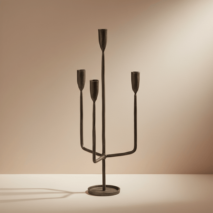 Bronze candelabra on a beige background