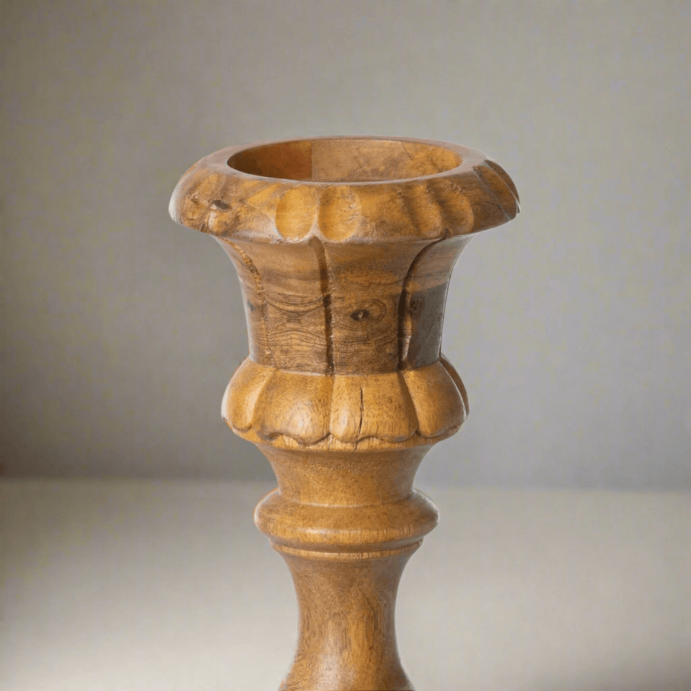 Close-up of hand-carved Tall Vintage Wooden Candle Holder with intricate details and warm patina.