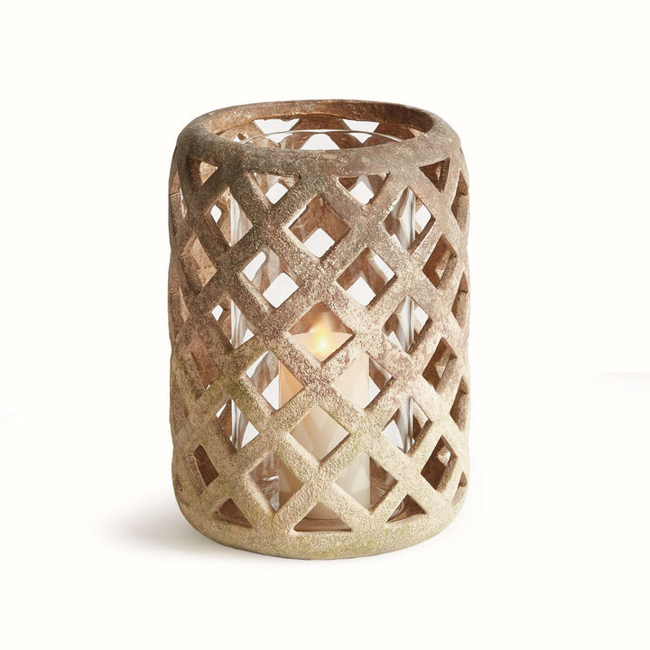Terracotta hurricane candle holder with glass insert featuring an airy lattice design for soft, flickering shadows.