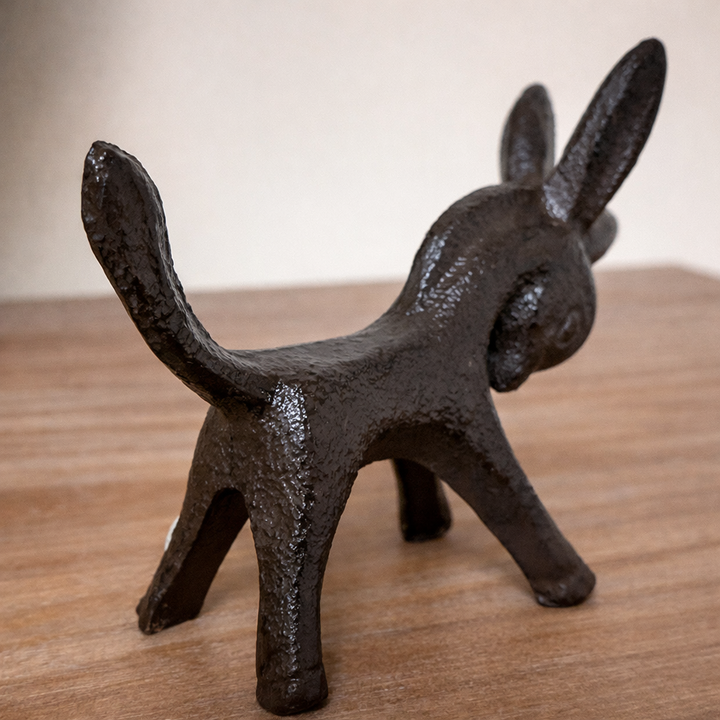 Rear view of Textured Cast Iron Donkey Figurine showing raised tail