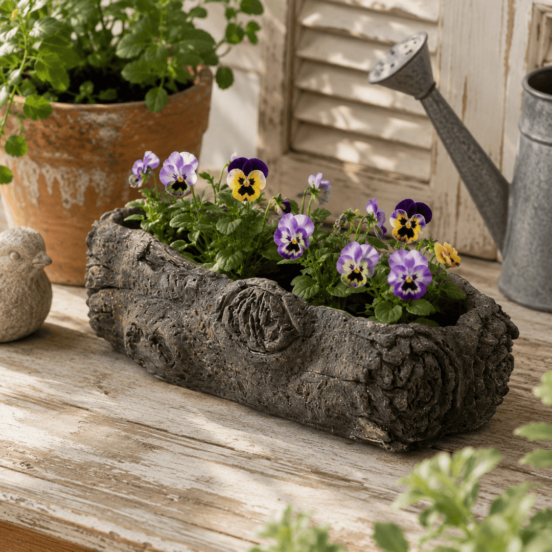 Large and small Textured Cement Log Planters with green plants