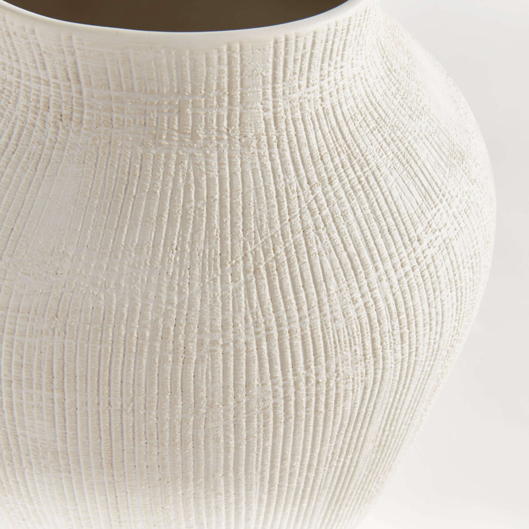 Textured white ceramic vase by Barclay Butera, showcasing cross-hatched surface design, reflecting timeless craftsmanship and modern elegance.
