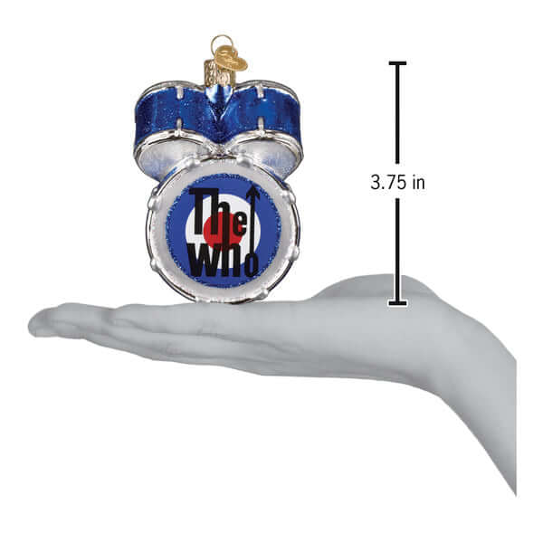 Hand holding The Who Drum Kit Christmas Ornament with blue sparkle and band logo, measuring 3.75 inches.