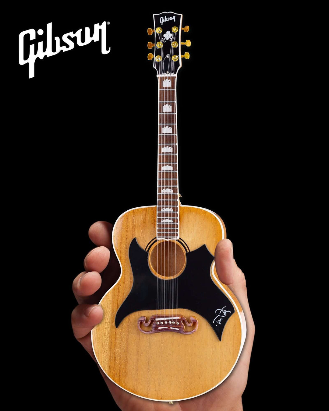 Handcrafted Tom Petty Gibson SJ-200 Wildflower Mini Guitar Replica held in hand, featuring signature details and Gibson logo