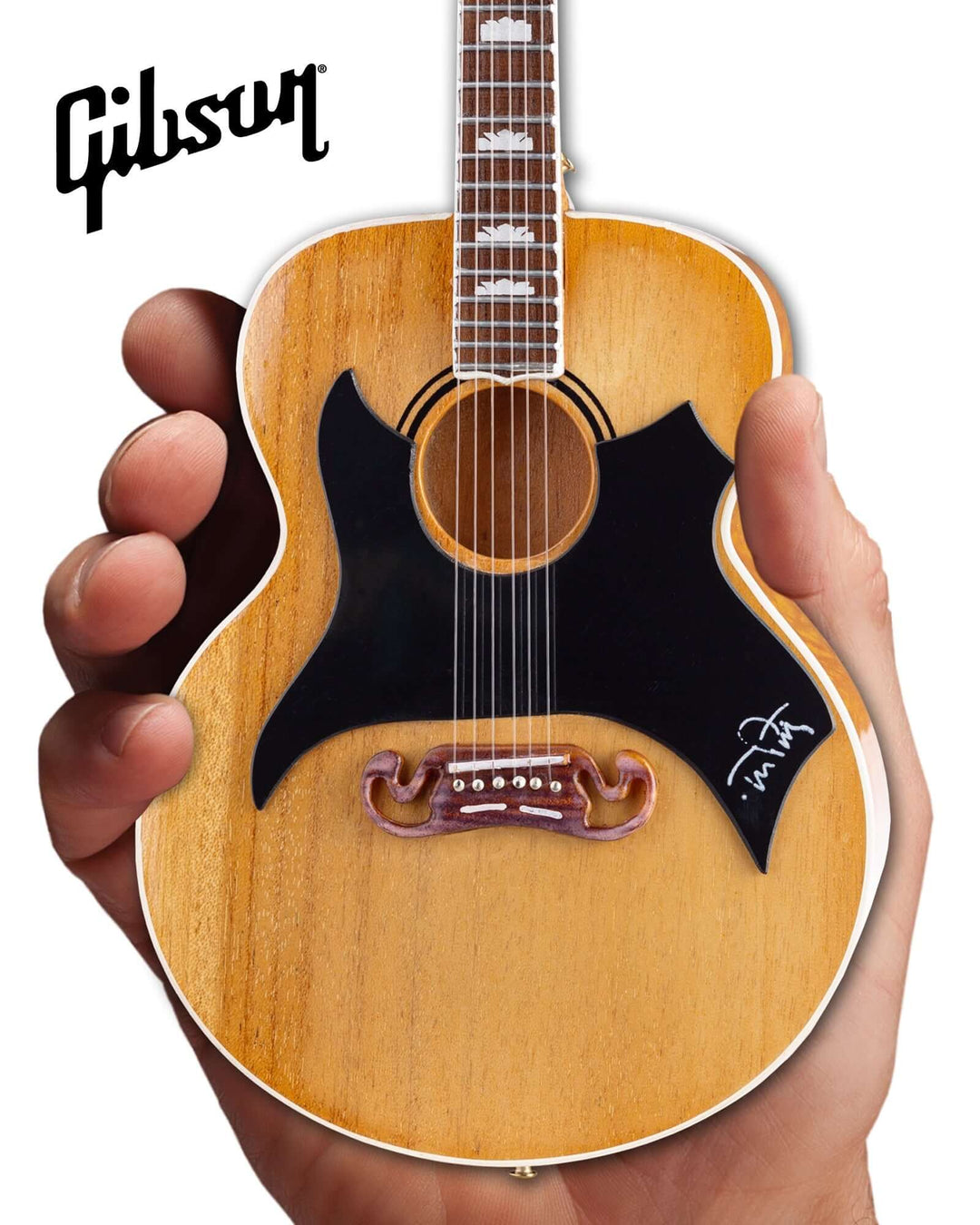 Hand holding Tom Petty Gibson SJ-200 Wildflower Mini Guitar Replica