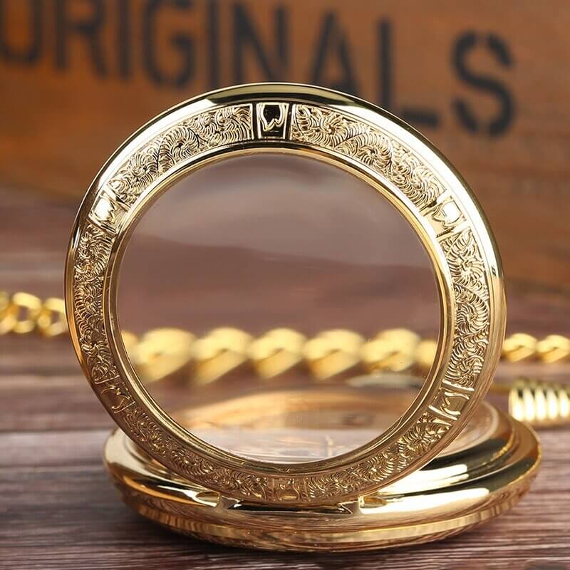 Vintage Silver and Gold Mechanical Pocket Watches with skeleton dial and intricate gold design on wooden background.