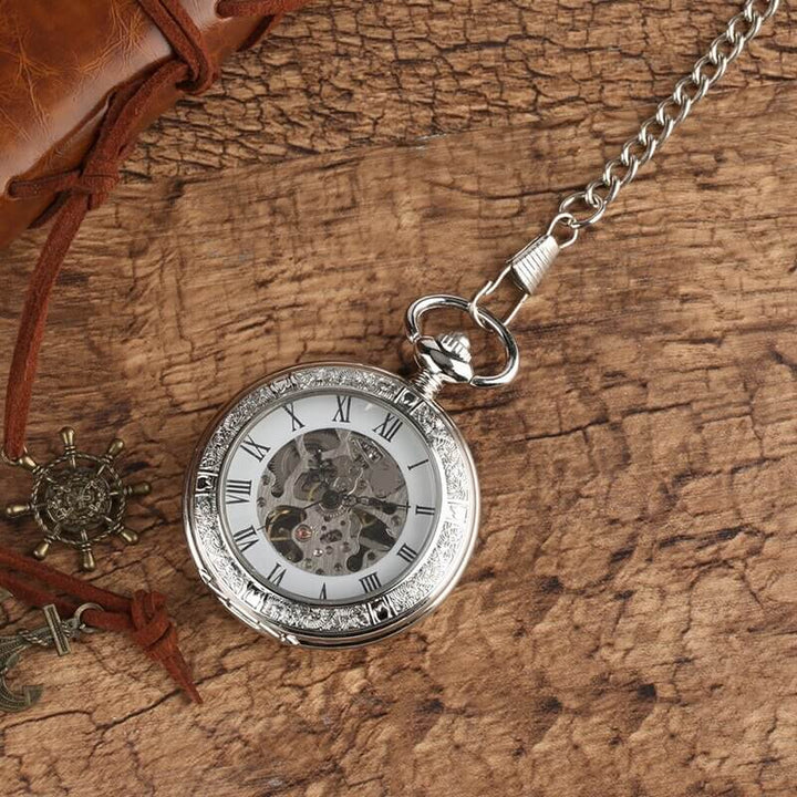 Vintage Silver and Gold Mechanical Pocket Watches with skeleton dial on rustic background