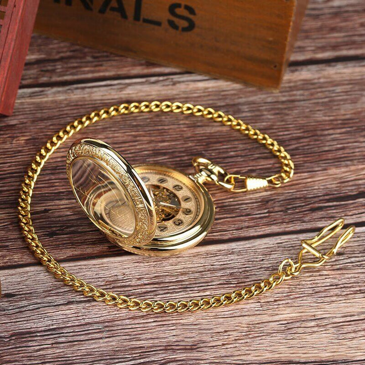 Vintage Silver and Gold Mechanical Pocket Watches with exposed mechanics and elegant chain on wooden surface.