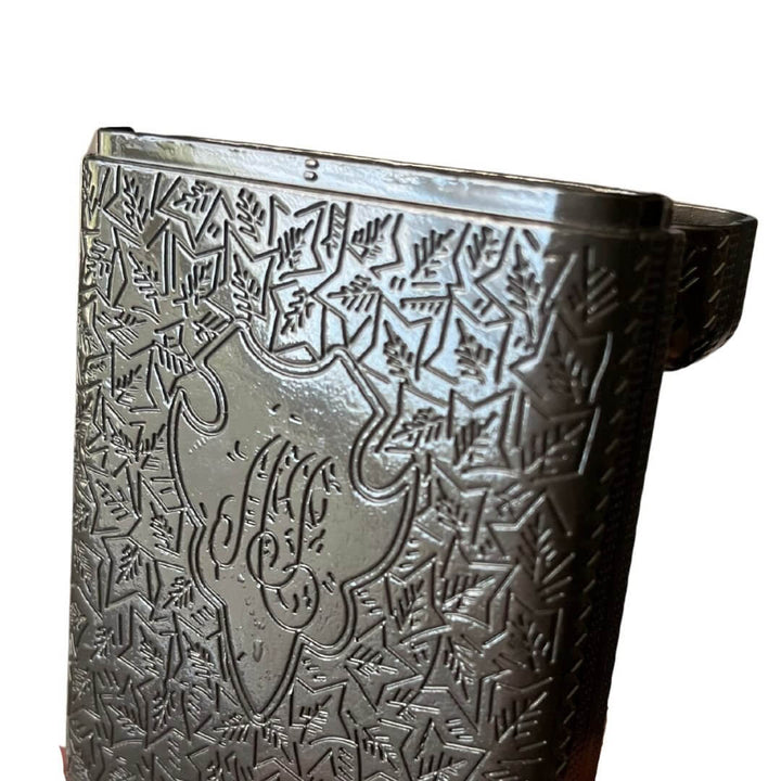 Vintage 1920s Cigarette Case with etched metal design and spring-loaded hinge, echoing Roaring Twenties elegance and craftsmanship.
