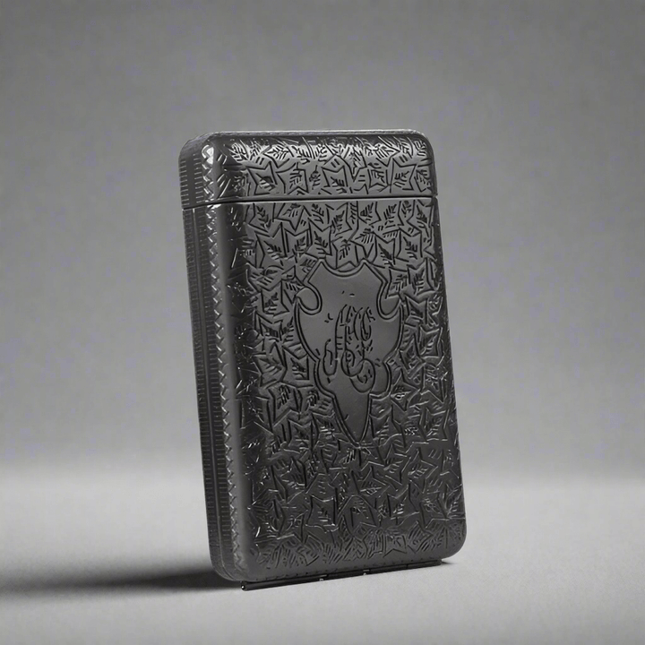 Vintage 1920s Cigarette Case with etched metal design and elegant craftsmanship.