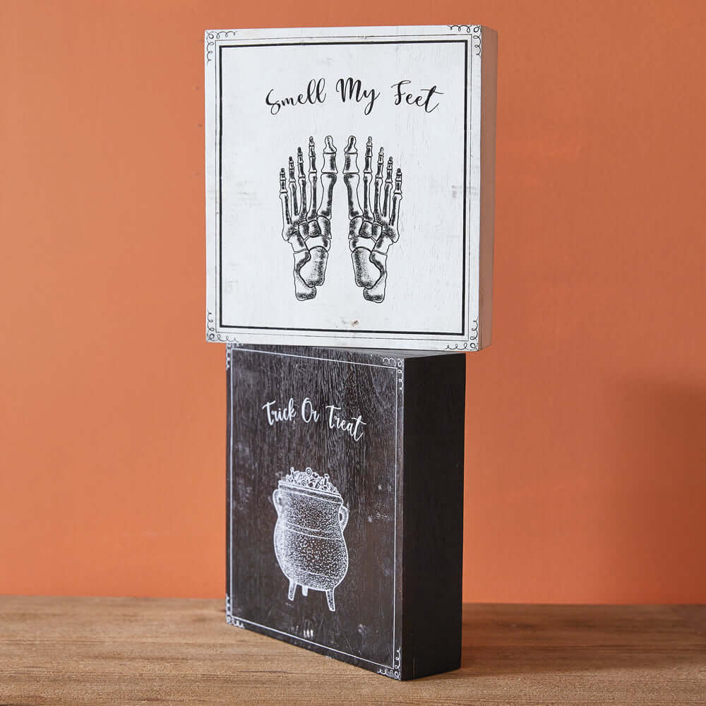 Vintage Halloween wood block signs set with skeleton feet and cauldron, "Trick-or-Treat Smell My Feet" design.