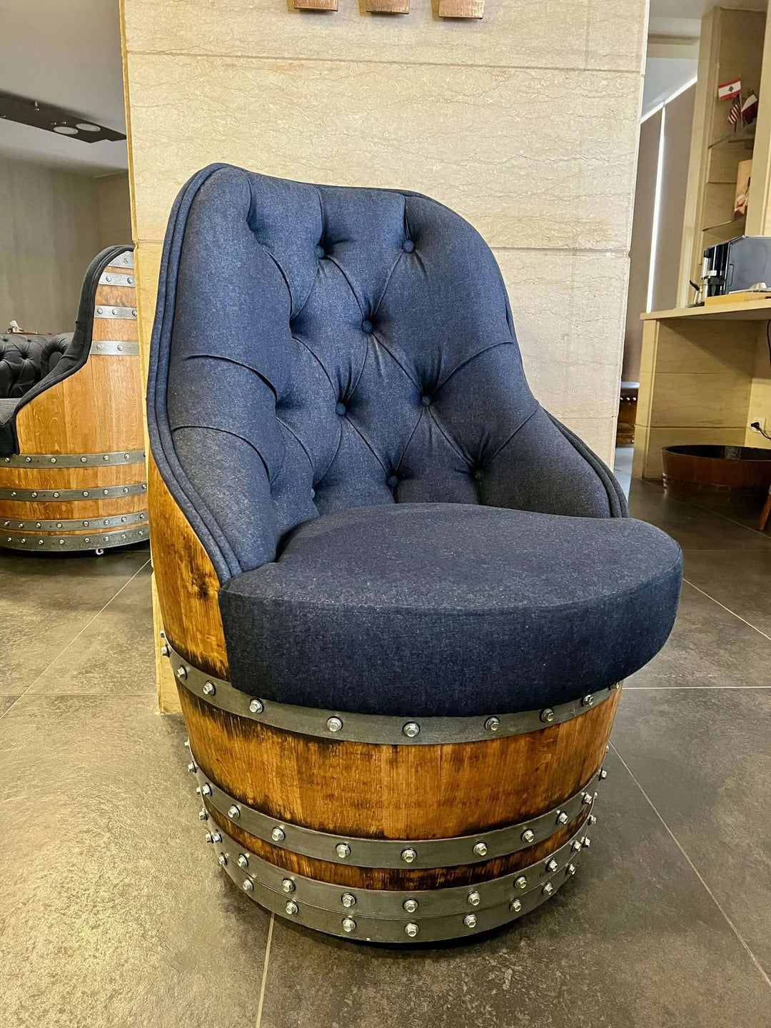 Tufted Vintage Barrel Chair with navy upholstery and reclaimed wood frame, showcasing farmhouse elegance in a handcrafted design.