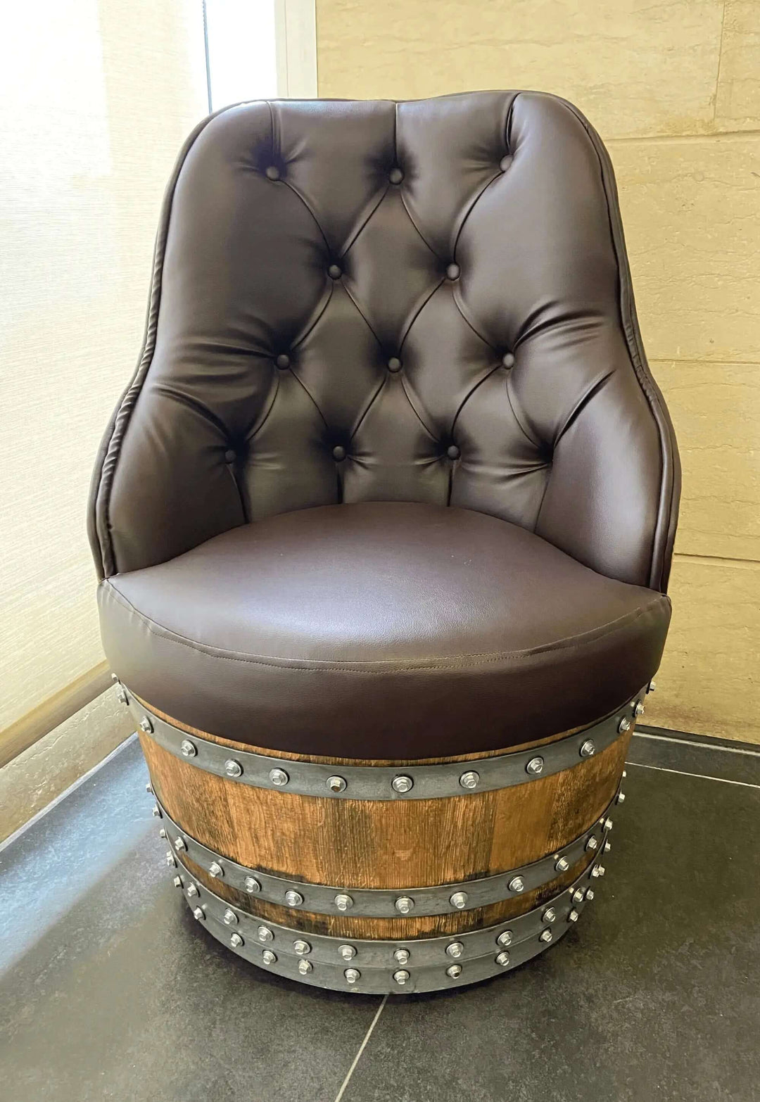 Tufted Vintage Barrel Chair with handcrafted upholstery and reclaimed wood base, showcasing farmhouse elegance and luxury.